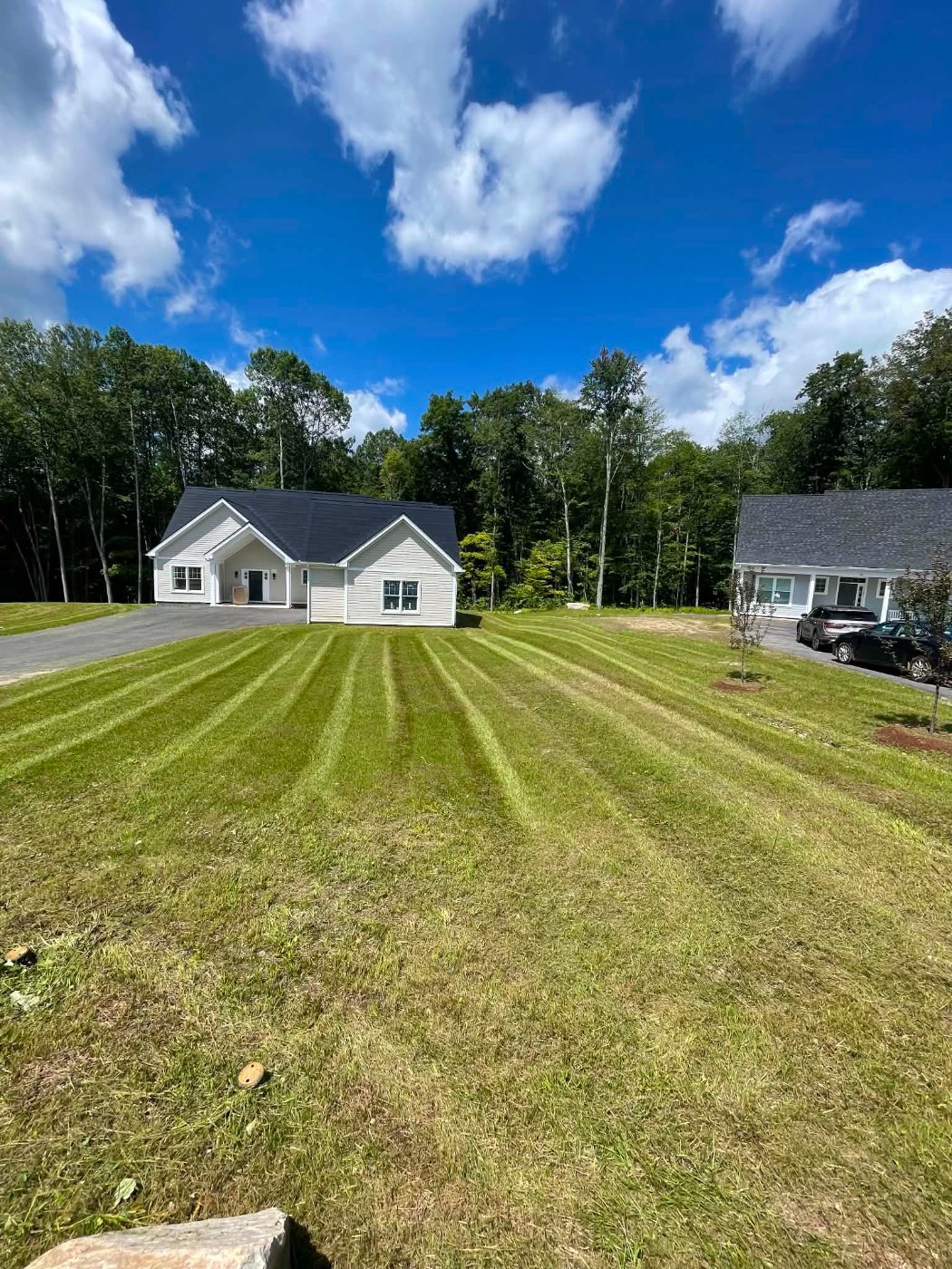 Freshly mowed lawn with crisp stripes at a newly built home