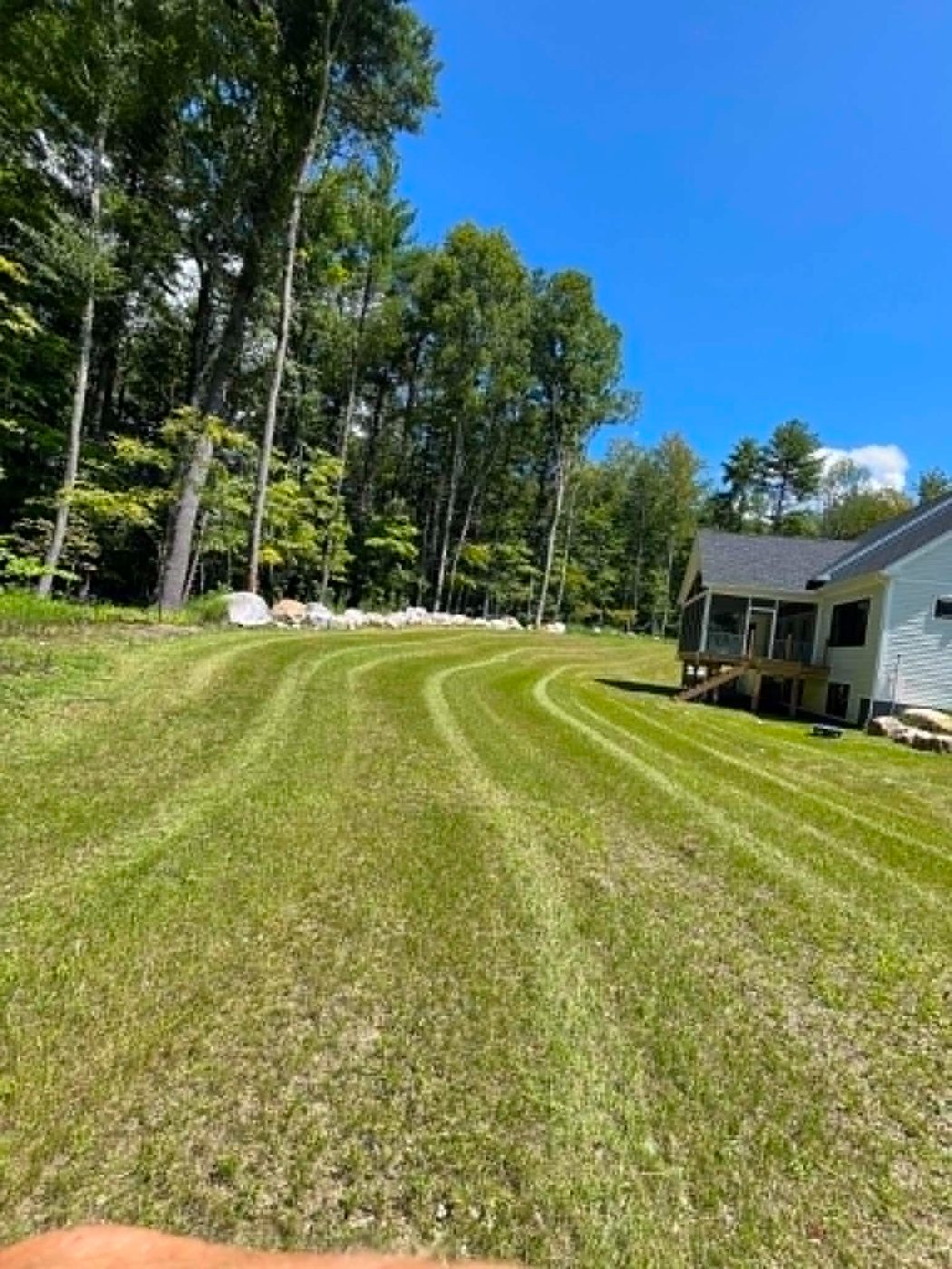Curved stripes running toward a new construction home